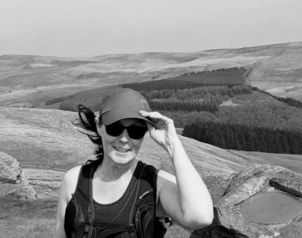 Helen's Story: Living with a acoustic Neuroma. Picture of Helen on top of dales.