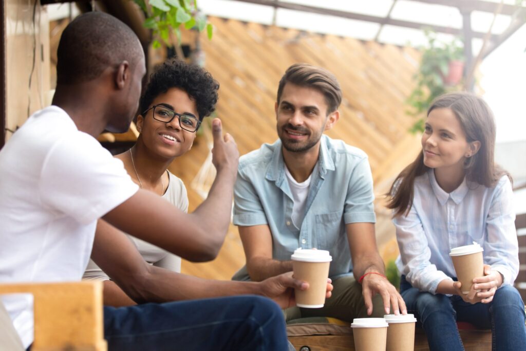 Image of group of people chatting representing the knowledge sharing of the Acoustic Neuroma community