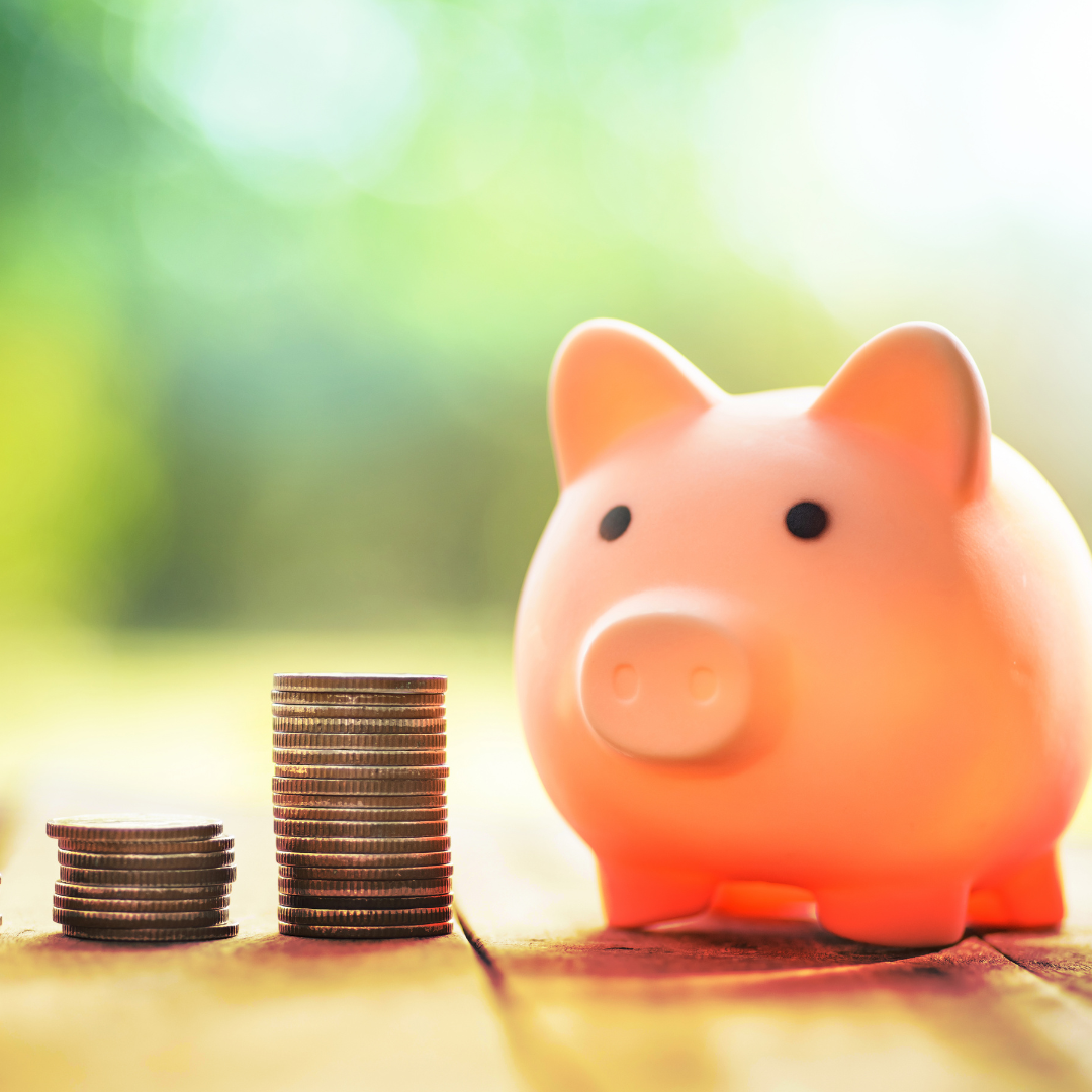 Picture of piggy bank with coins to illustrate theme of cost of living.